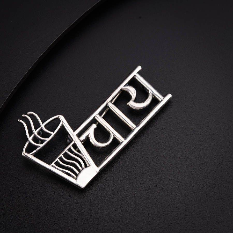 a close up of a metal object on a black surface
