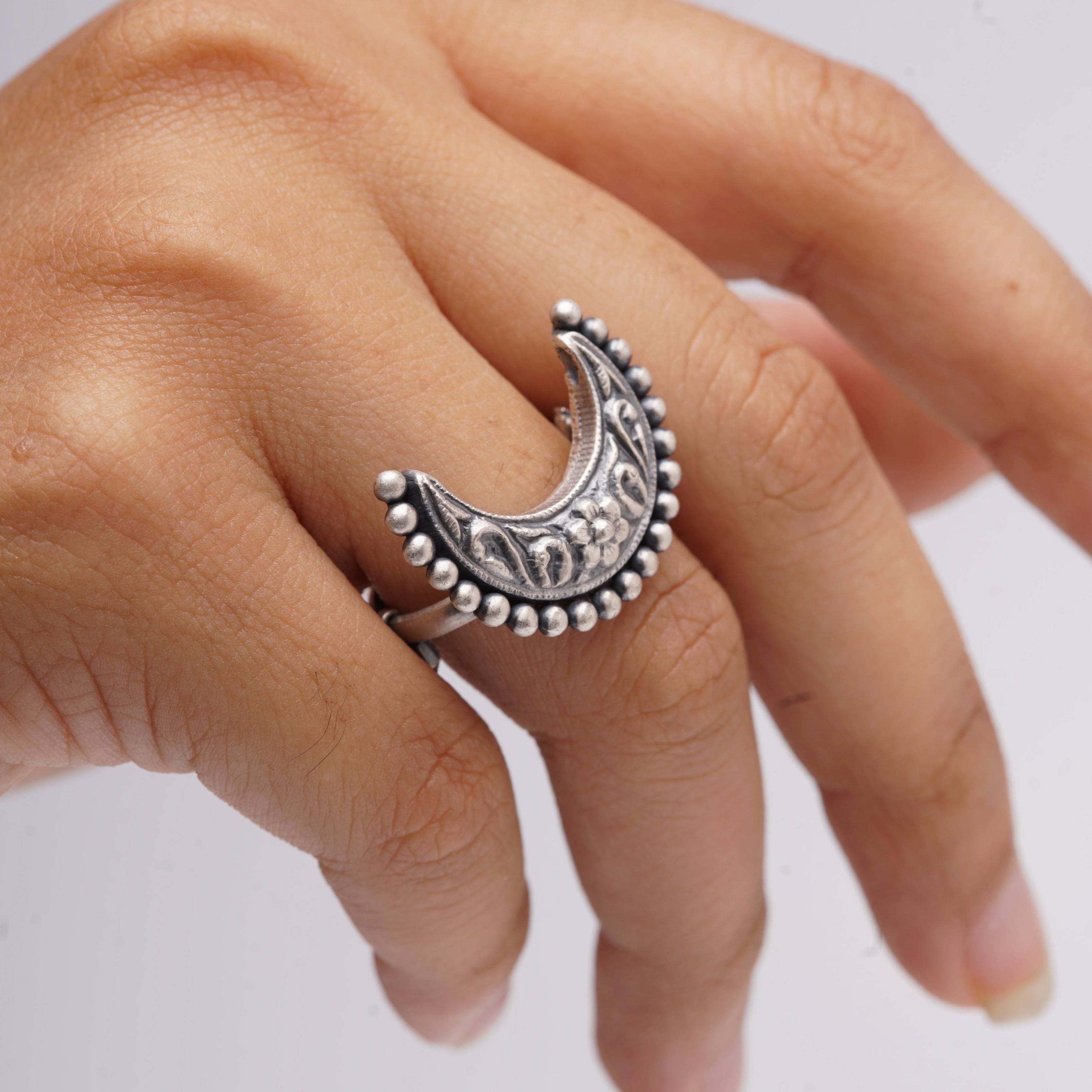 a woman's hand with a ring on it