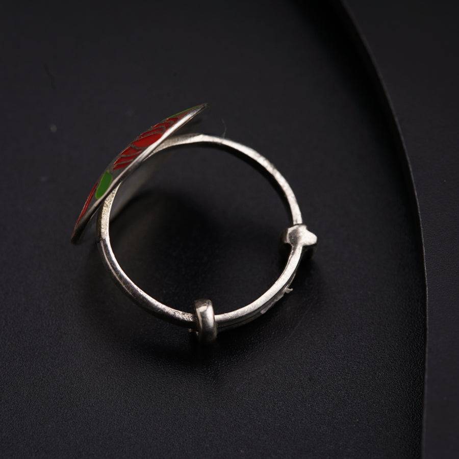 a close up of a ring on a black surface