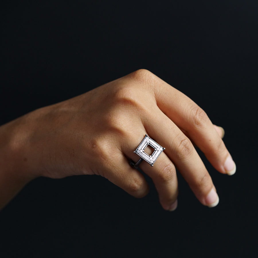 a woman's hand with a ring on it