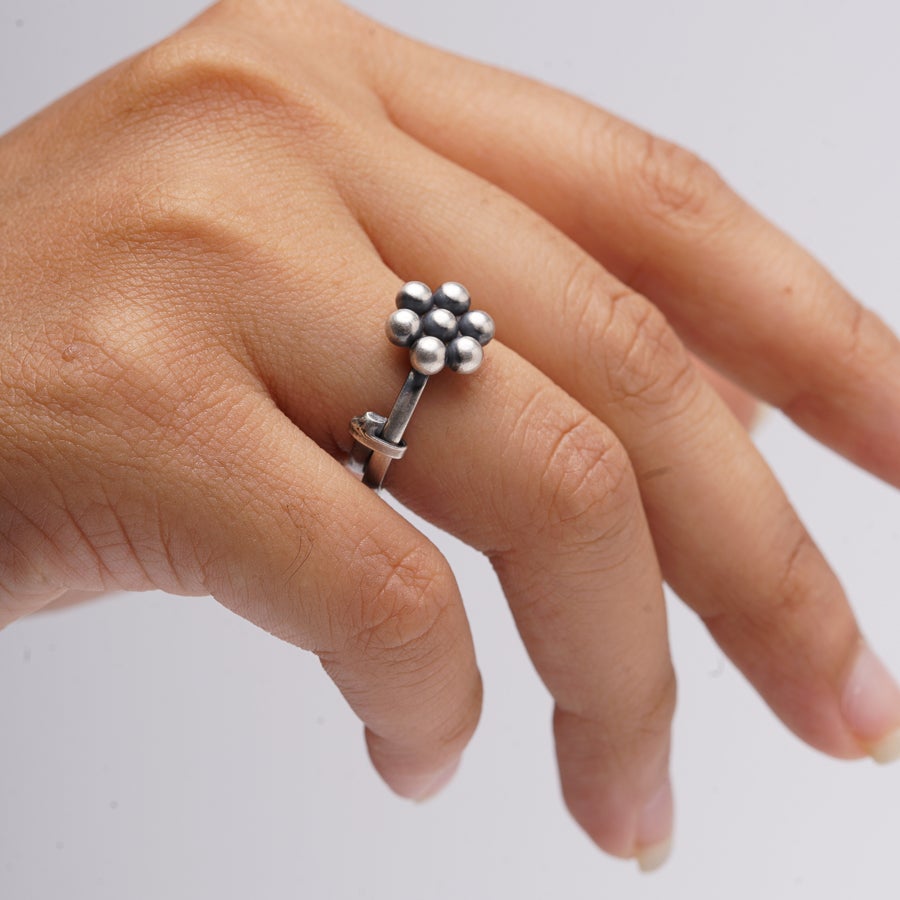 a woman's hand with a ring on it