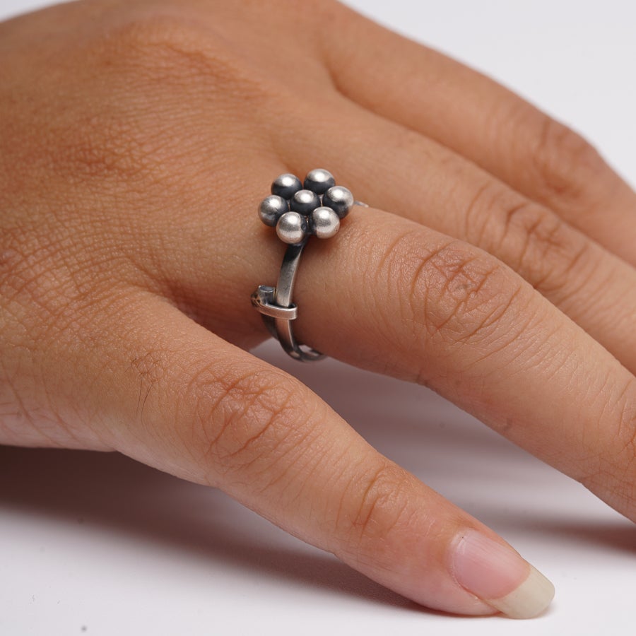 a woman's hand with a ring on it
