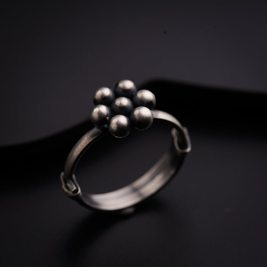 a close up of a ring on a black surface