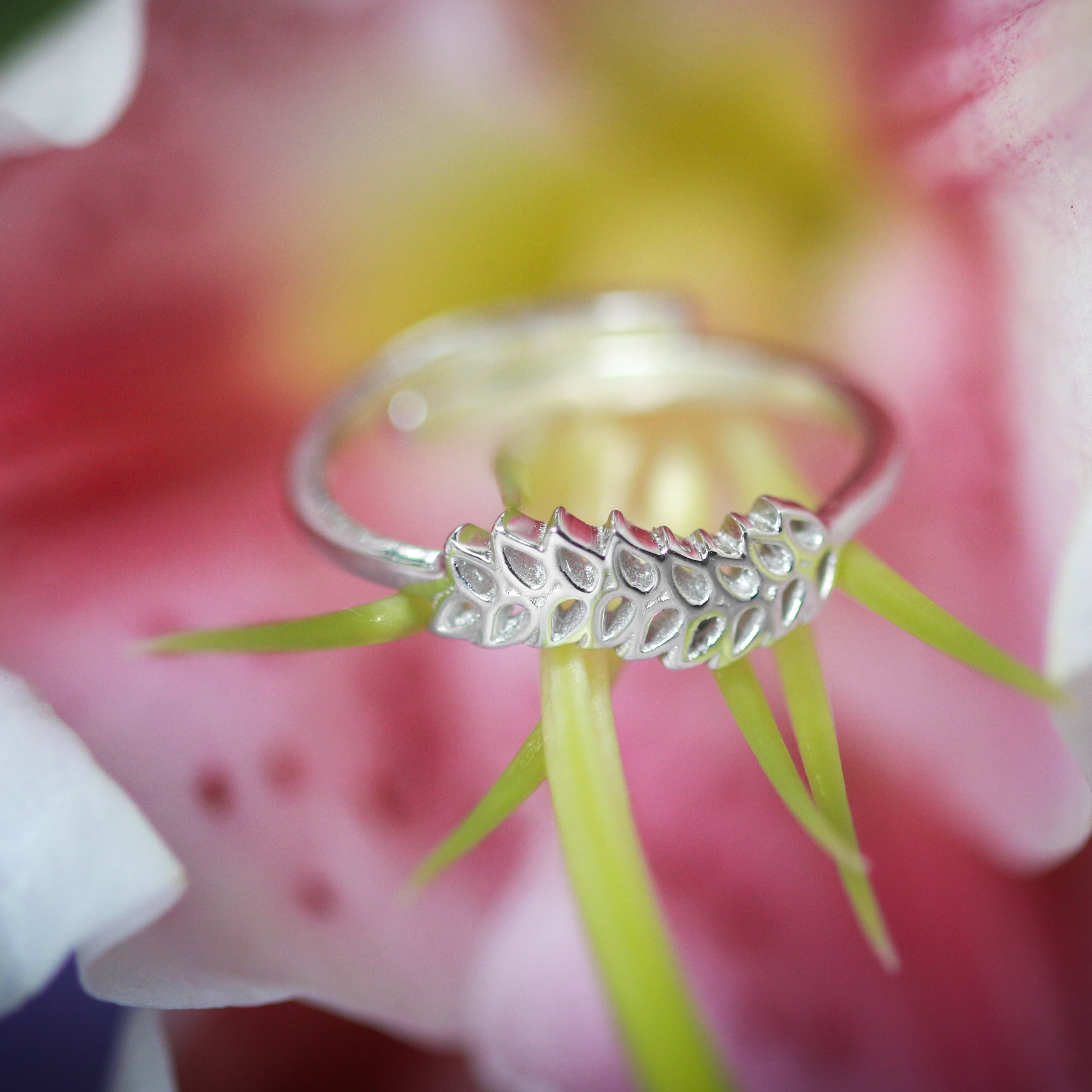 a close up of a ring on a flower
