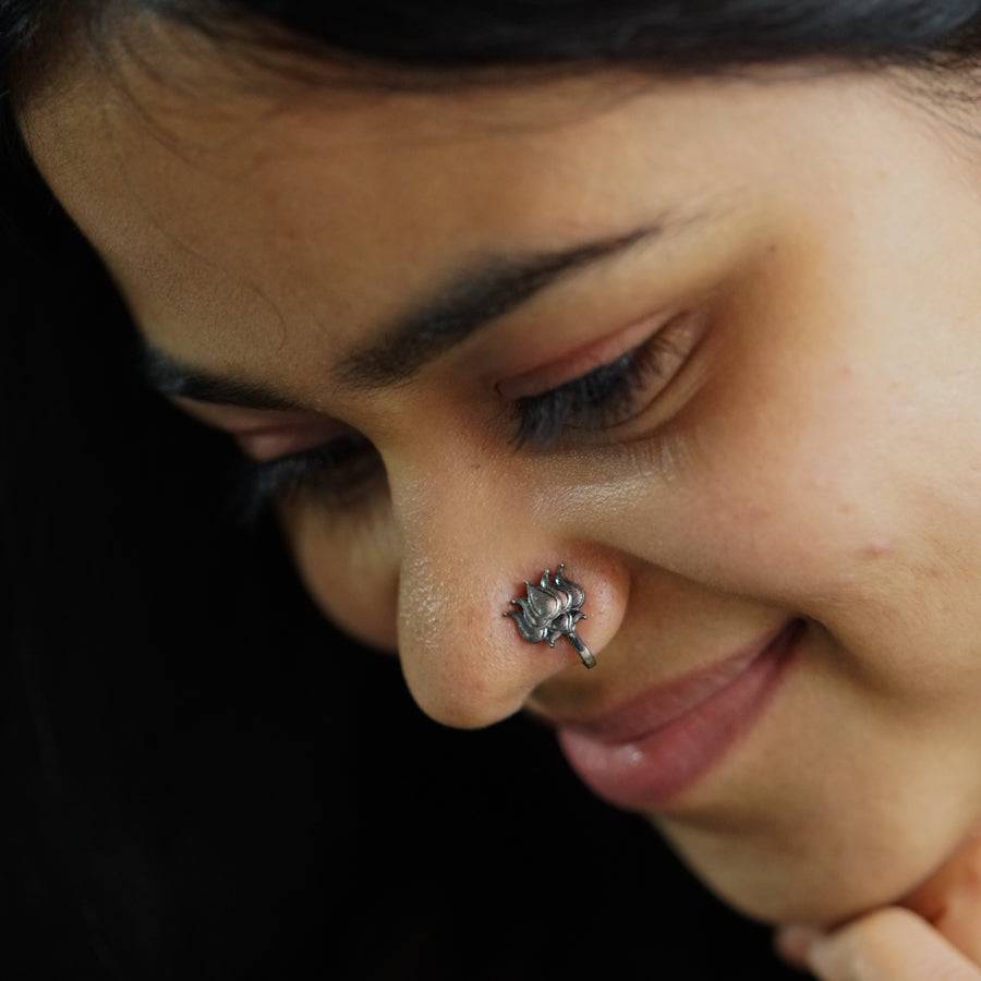 a close up of a person with a nose piercing