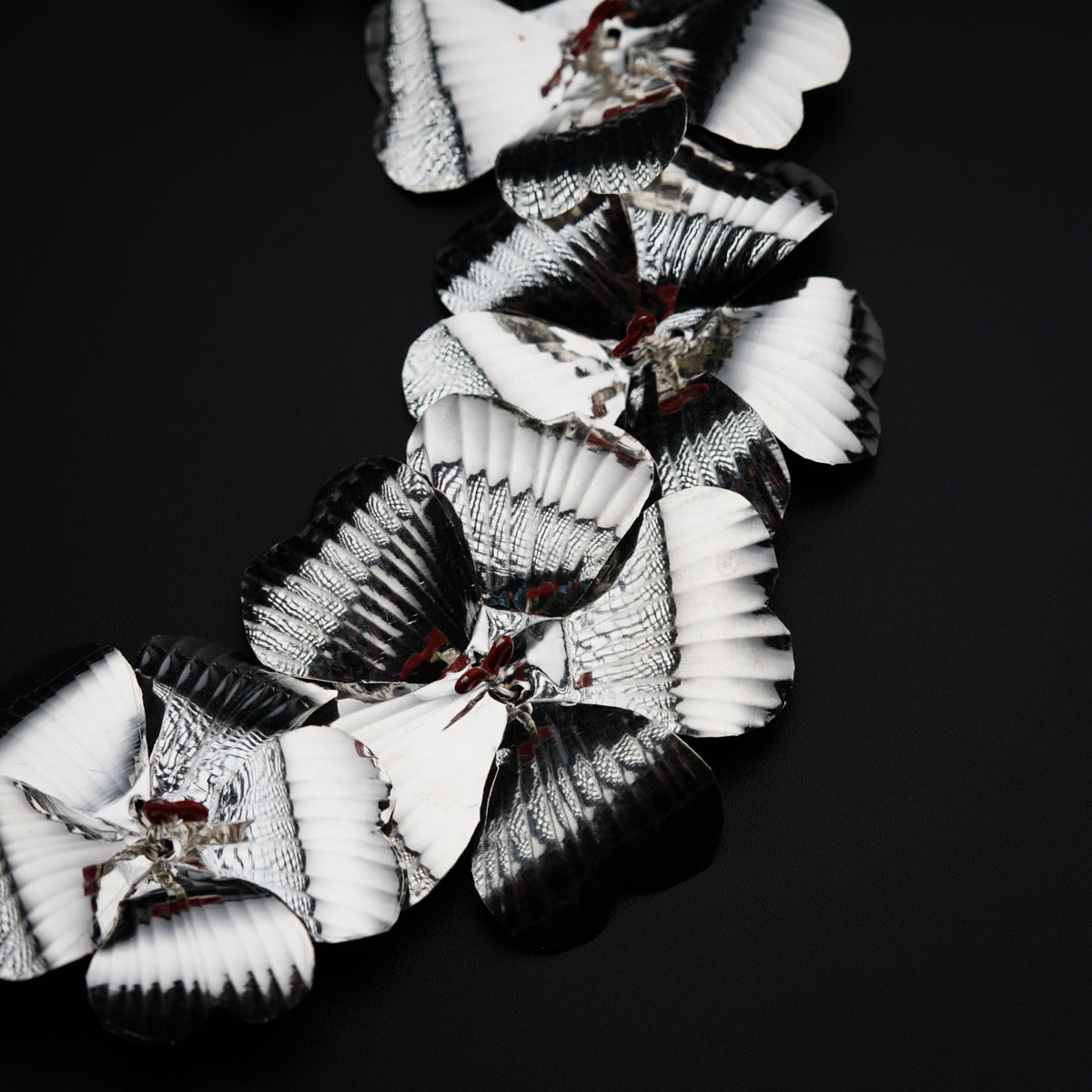 a black and white photo of paper flowers