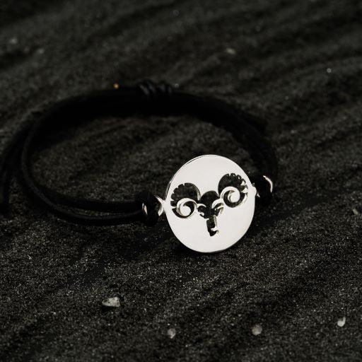 a bracelet with a ram head on it