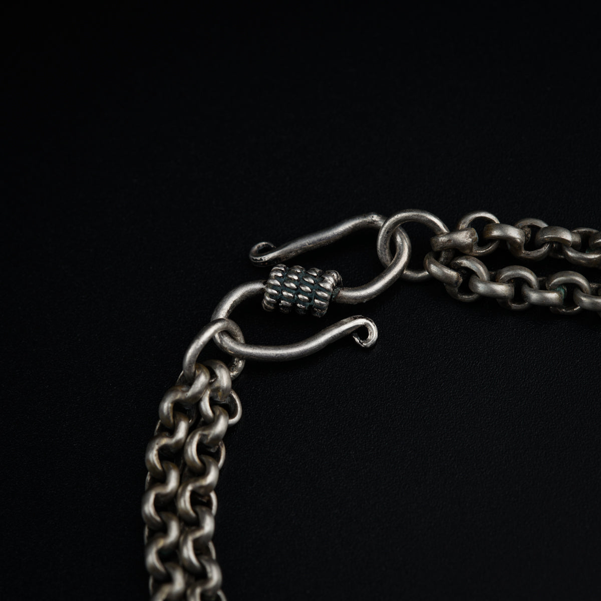 a close up of a chain with a lock on it