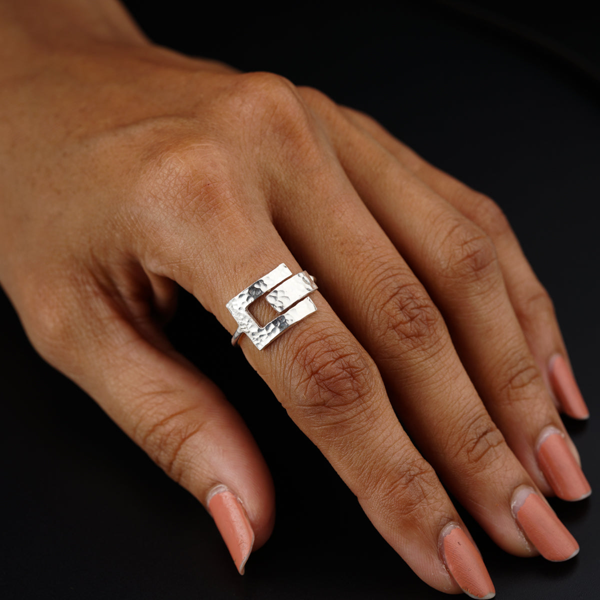 a woman's hand with a ring on it