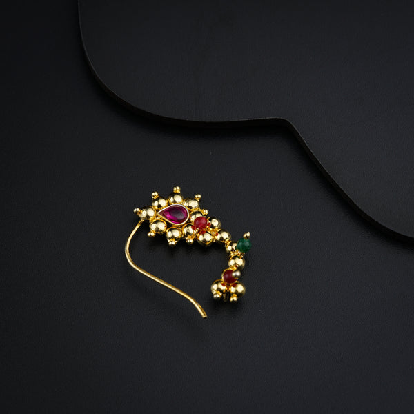 a close up of a hair pin on a black surface