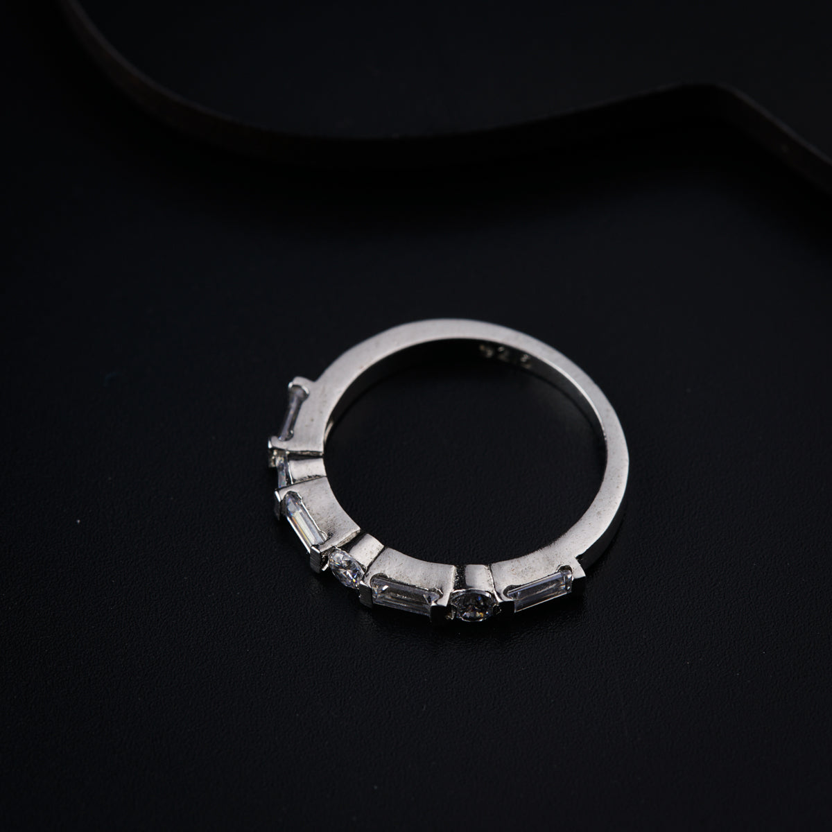 a close up of a ring on a black surface