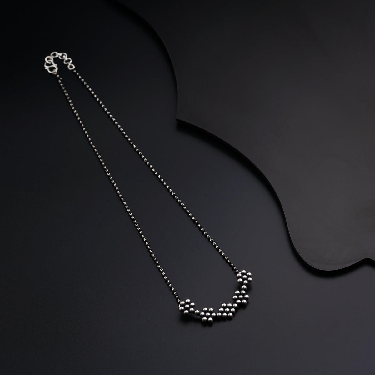 a long necklace with beads hanging from it