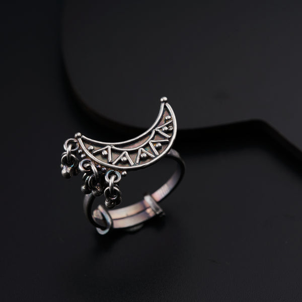 a close up of a ring on a black surface