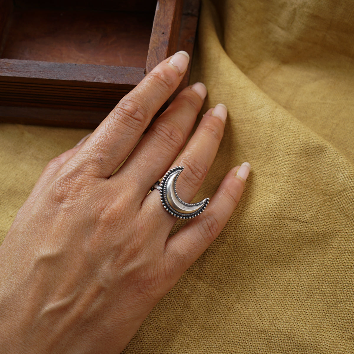 a woman's hand with a ring on it