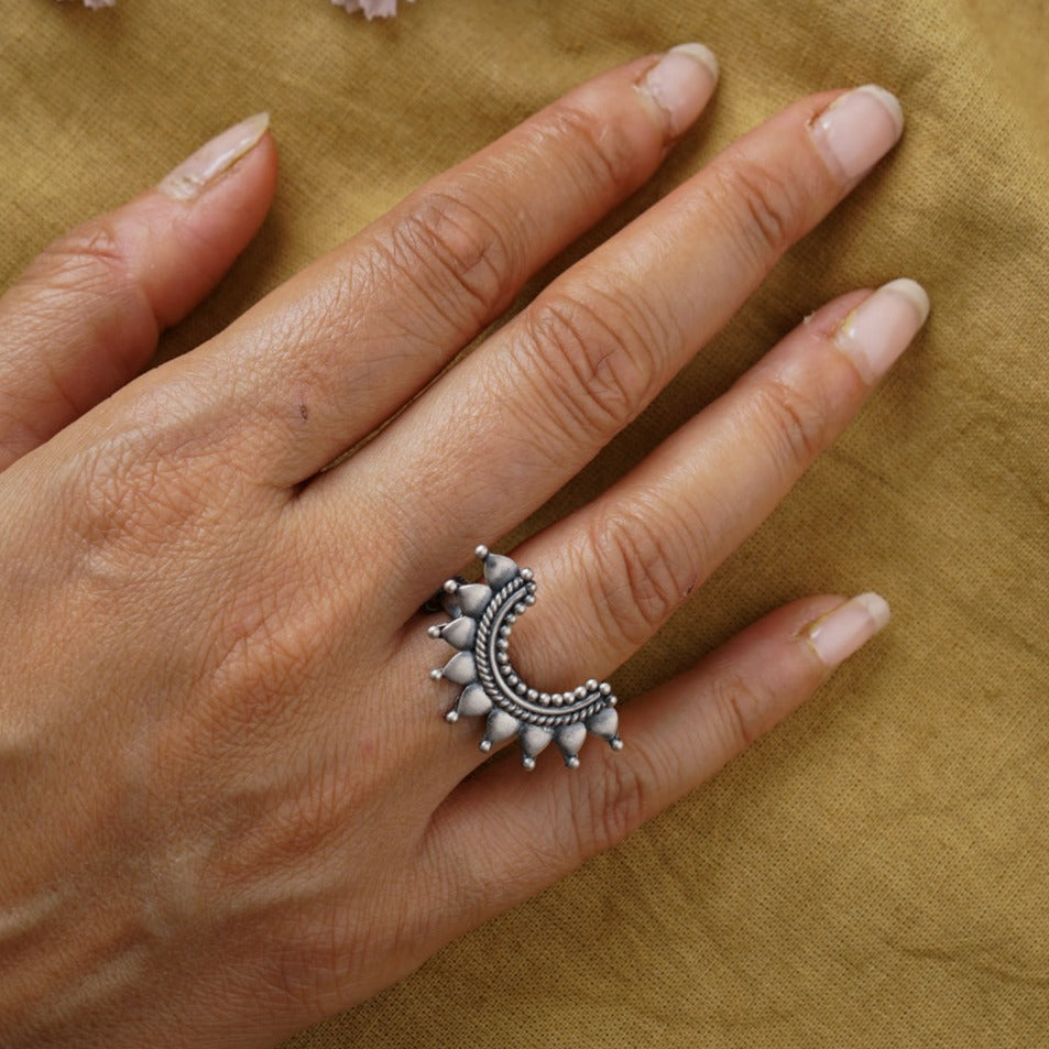 a woman's hand with a ring on it