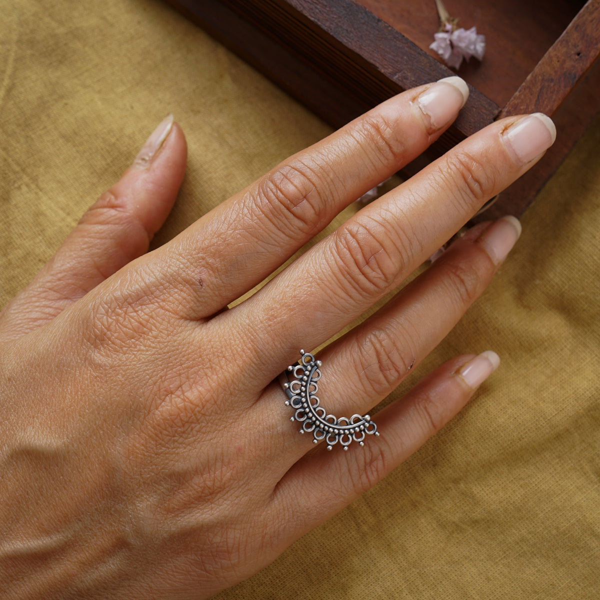 a woman's hand with a ring on it