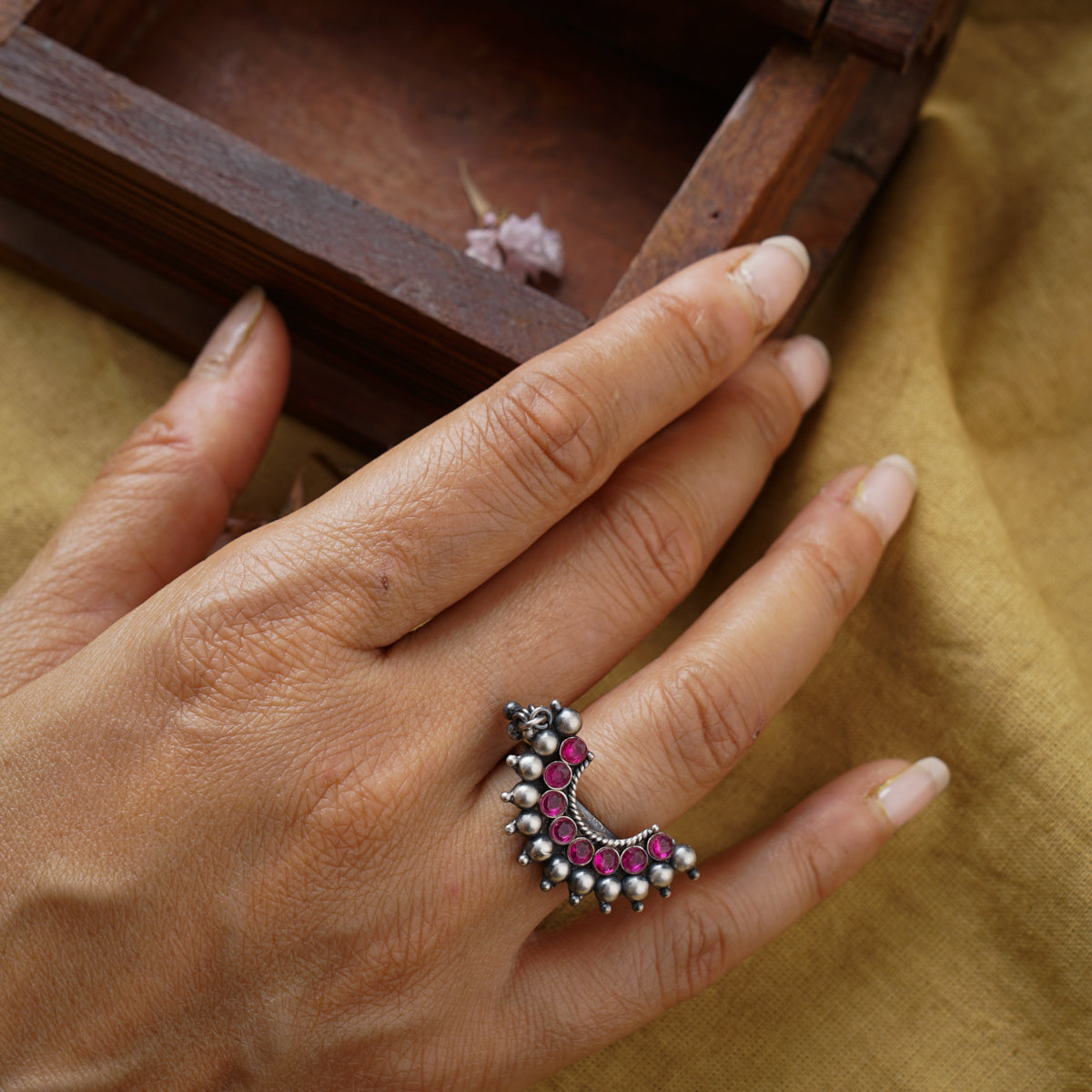 a woman's hand with a ring on it