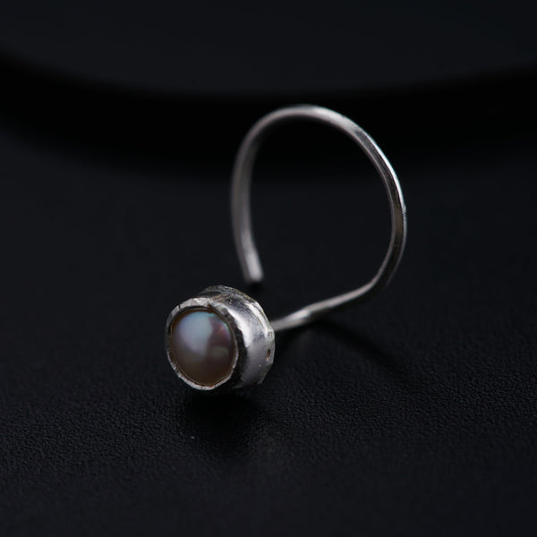 a close up of a ring on a black surface