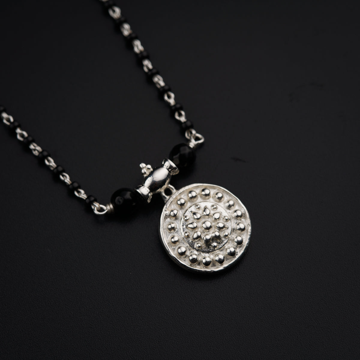 a necklace with a smiley face on it