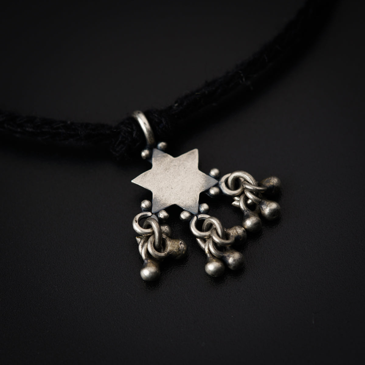 a necklace with a star of david on it