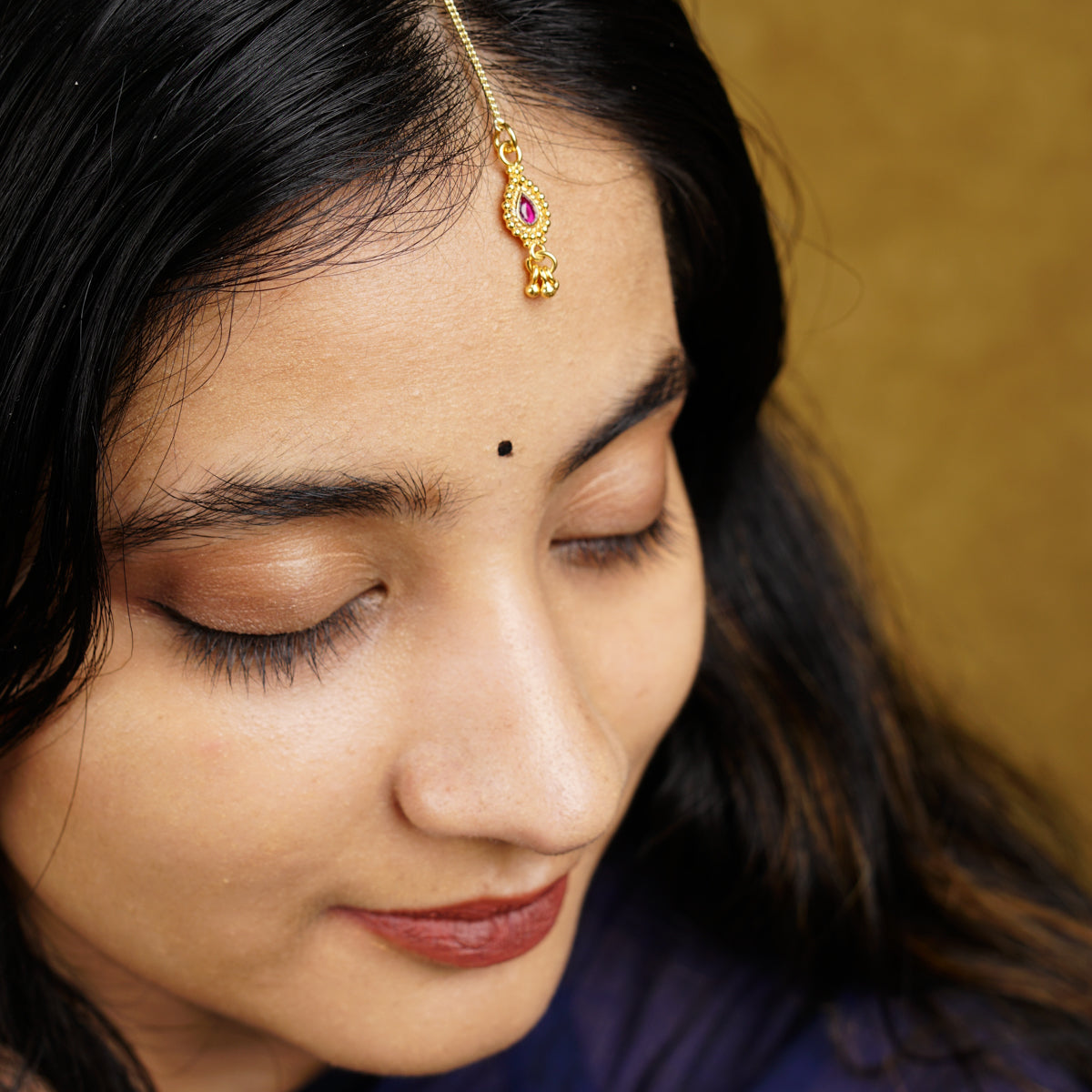 a close up of a person wearing a head piece