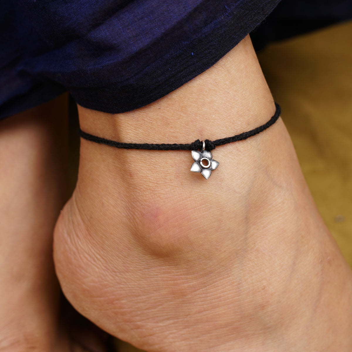 a close up of a person wearing a bracelet