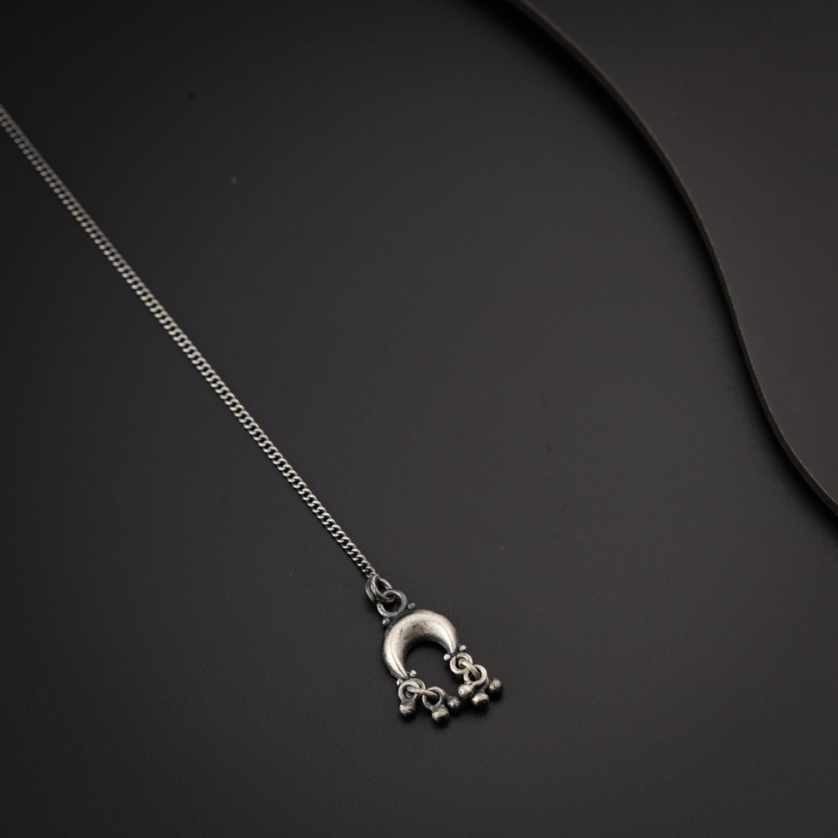a necklace with a skull and crossbones on it