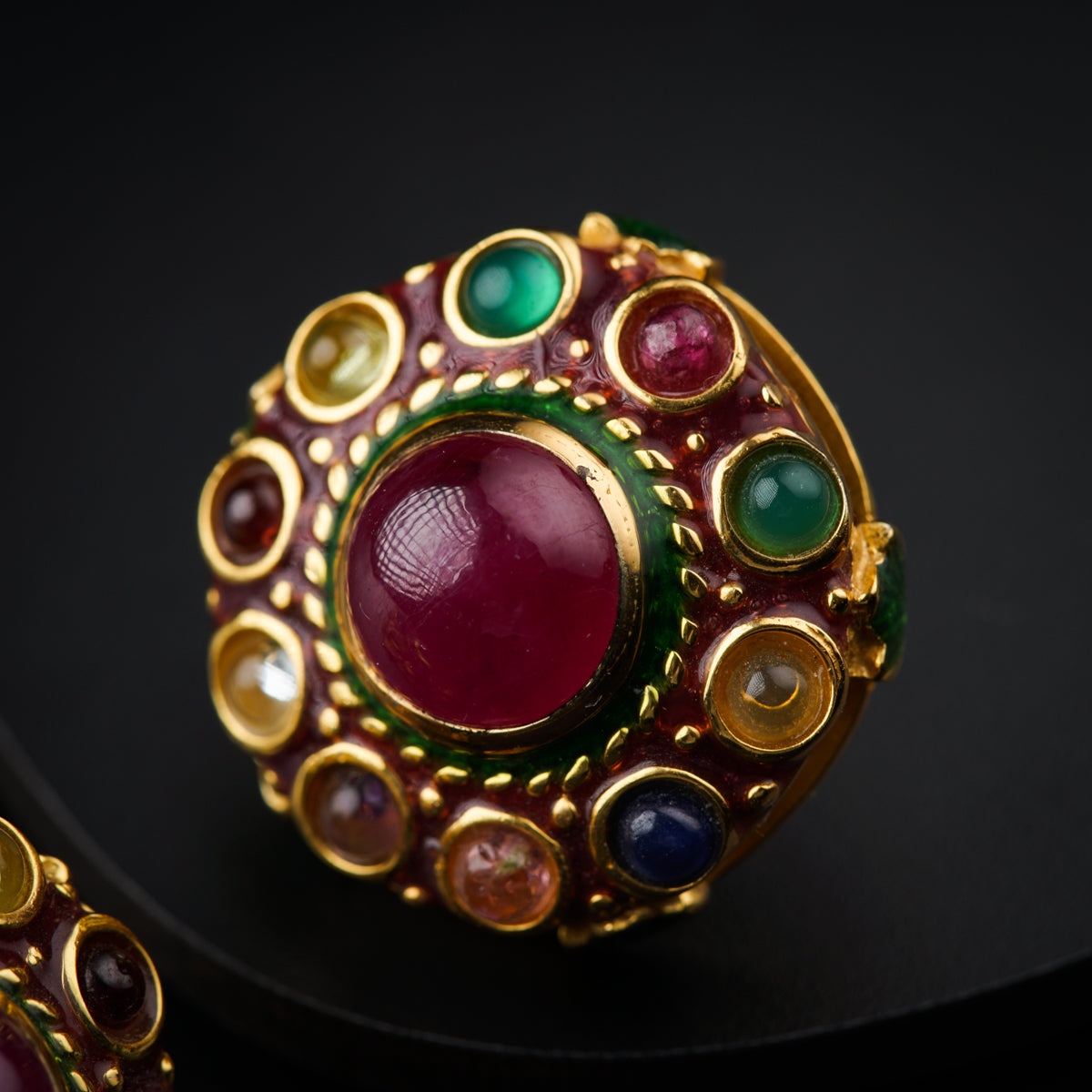 a close up of a ring on a black surface