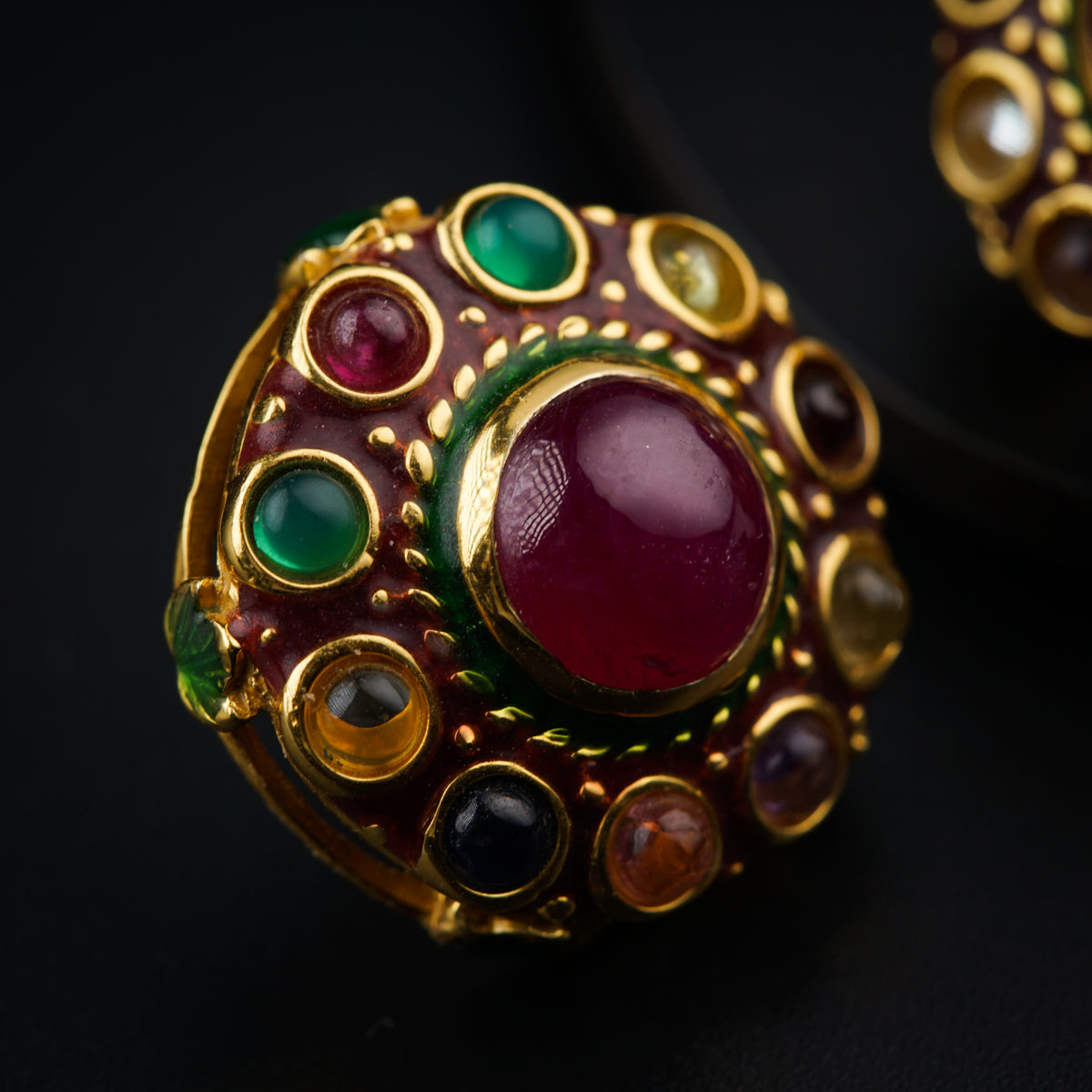 a close up of a ring on a black surface