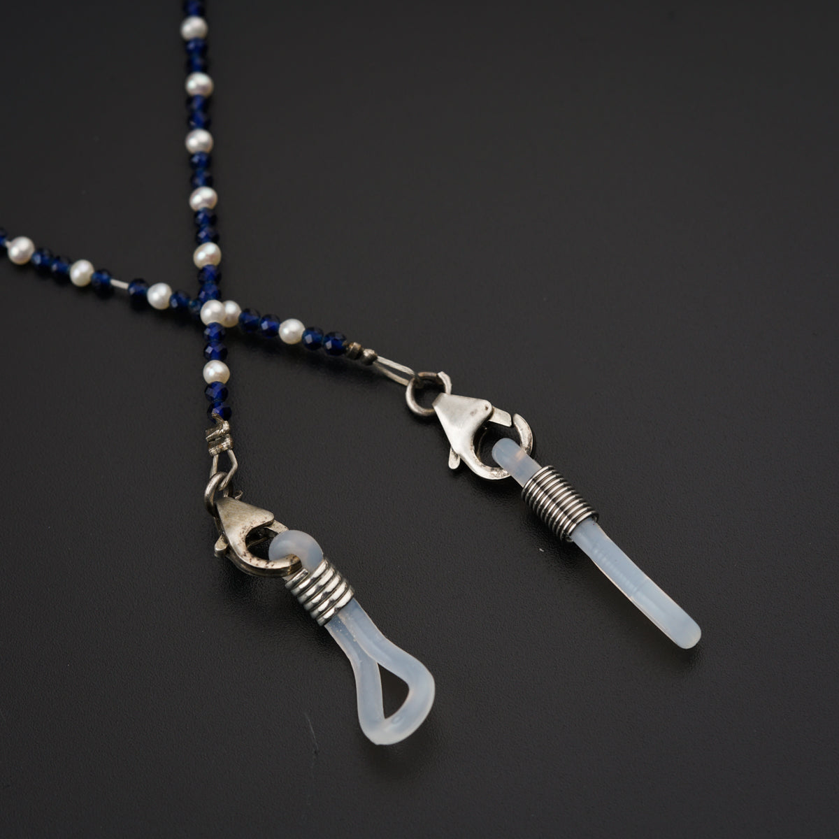 a necklace with a pair of scissors hanging from it