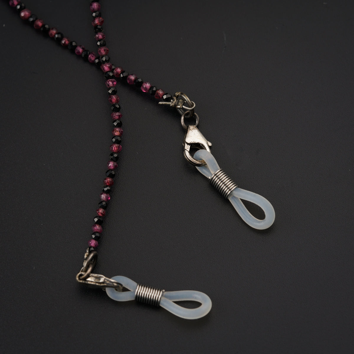 a necklace with a pair of scissors hanging from it