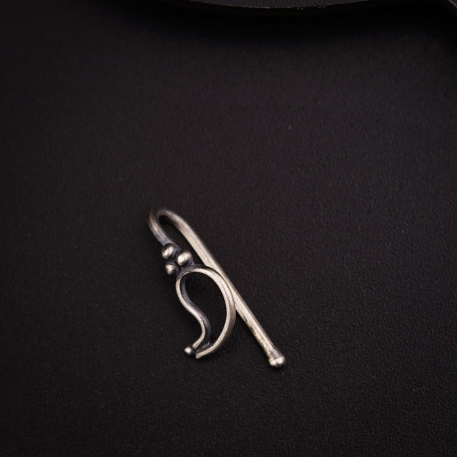 a pair of scissors sitting on top of a black surface