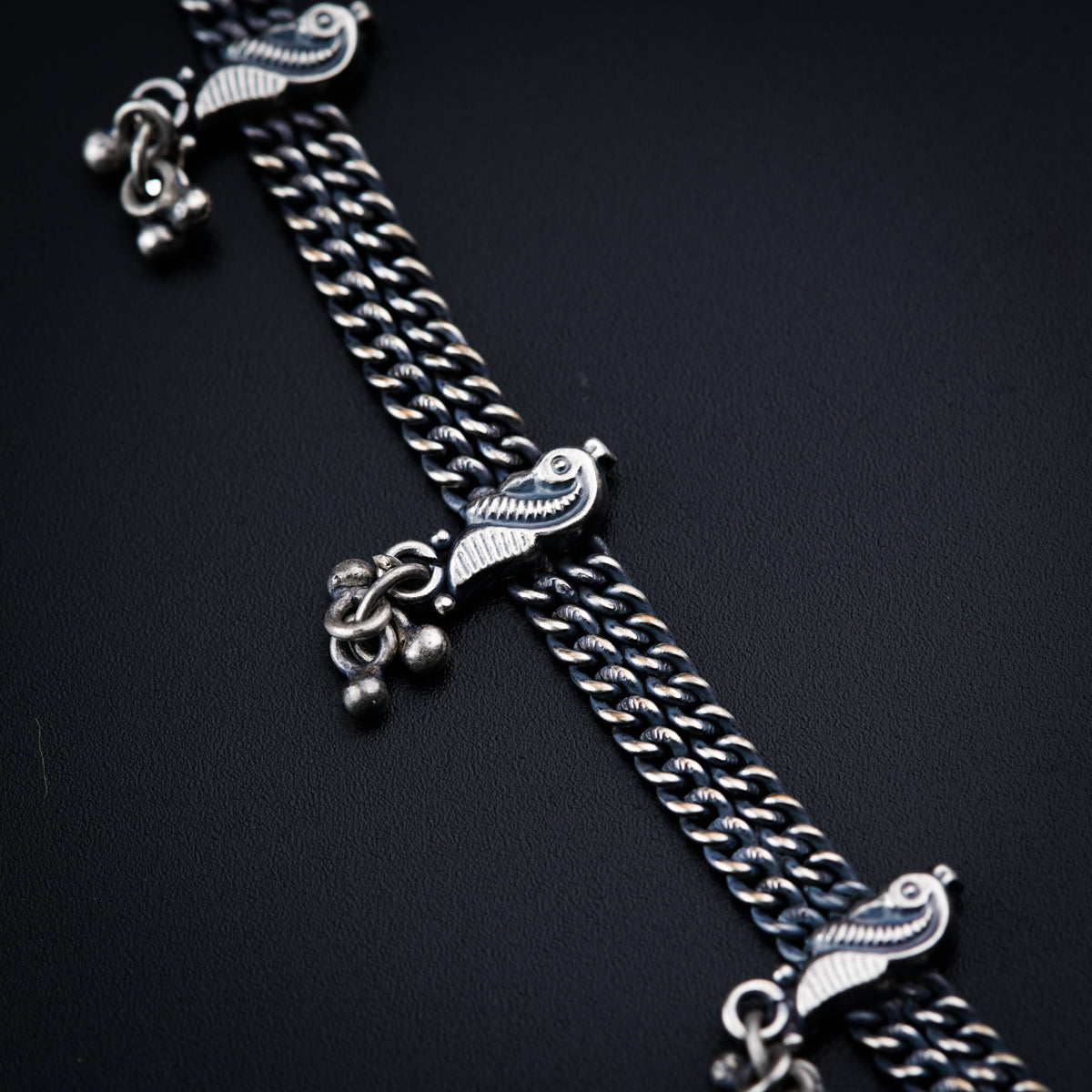 a cross with a chain attached to it