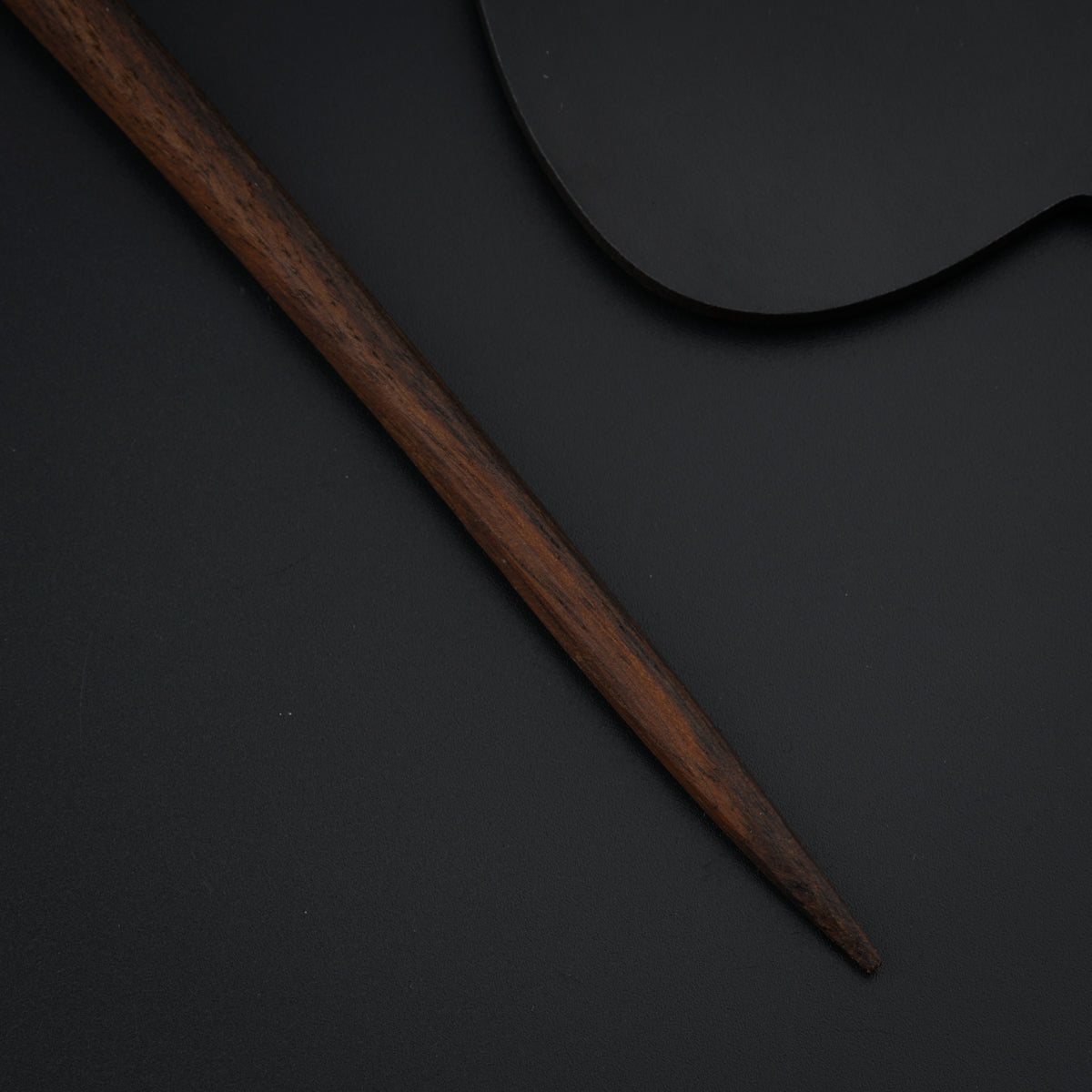 a baseball bat and a ball on a table