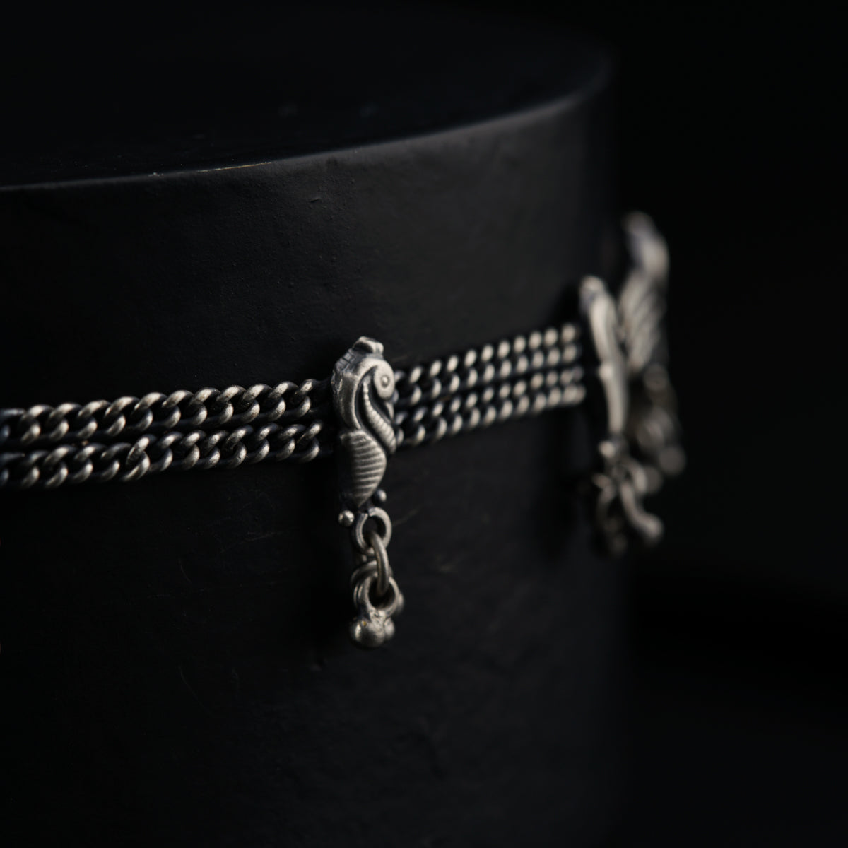 a close up of a black hat on a black background