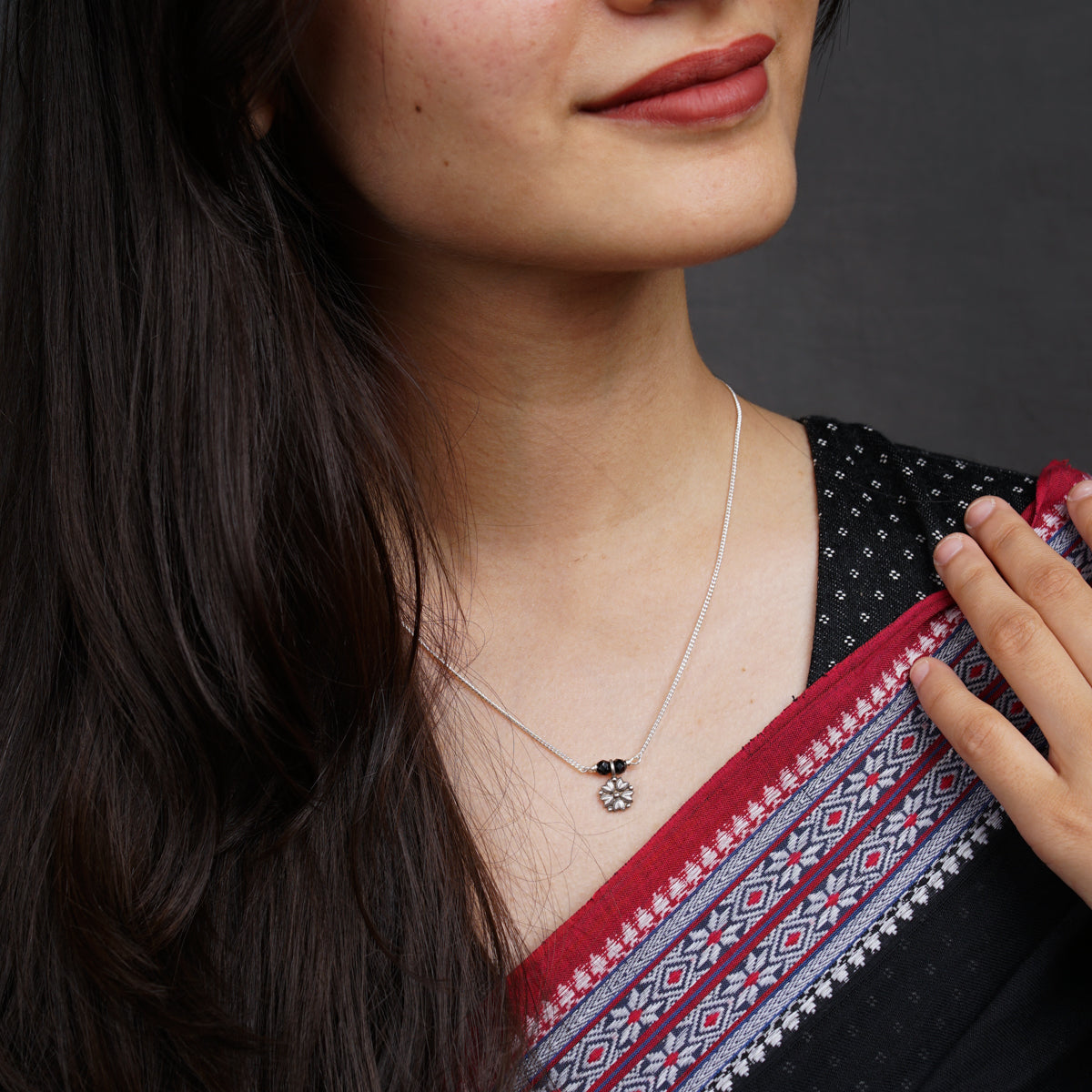 a woman is holding a piece of cloth