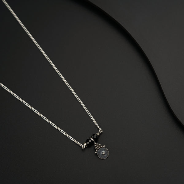 a couple of necklaces sitting on top of a table