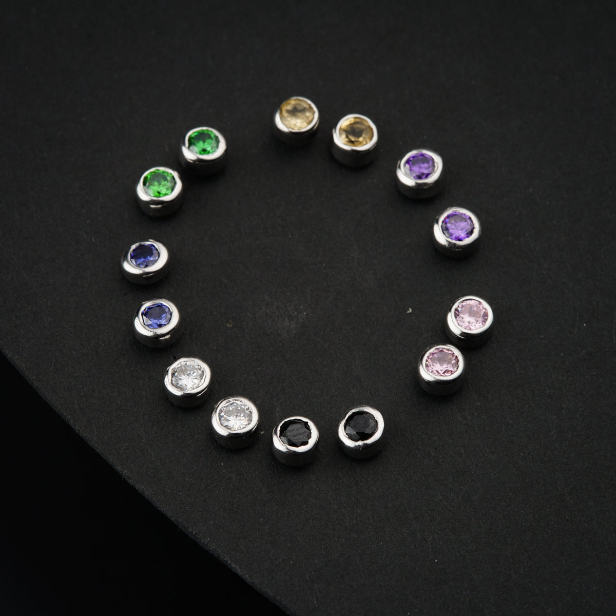 a group of different colored stones arranged in a circle