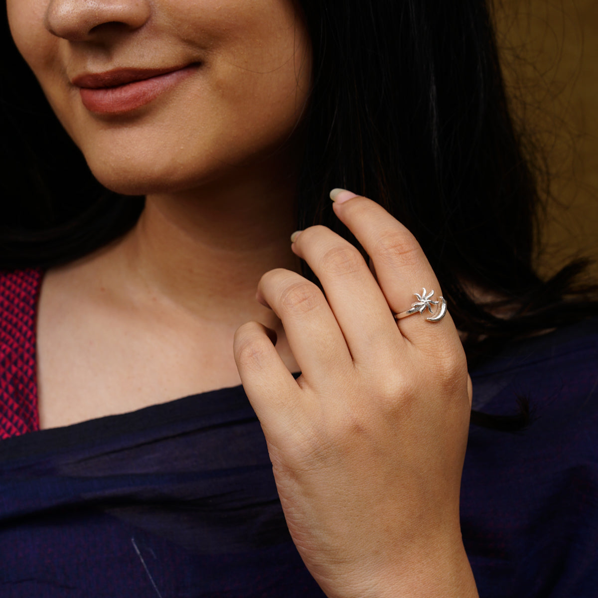 a close up of a person wearing a ring