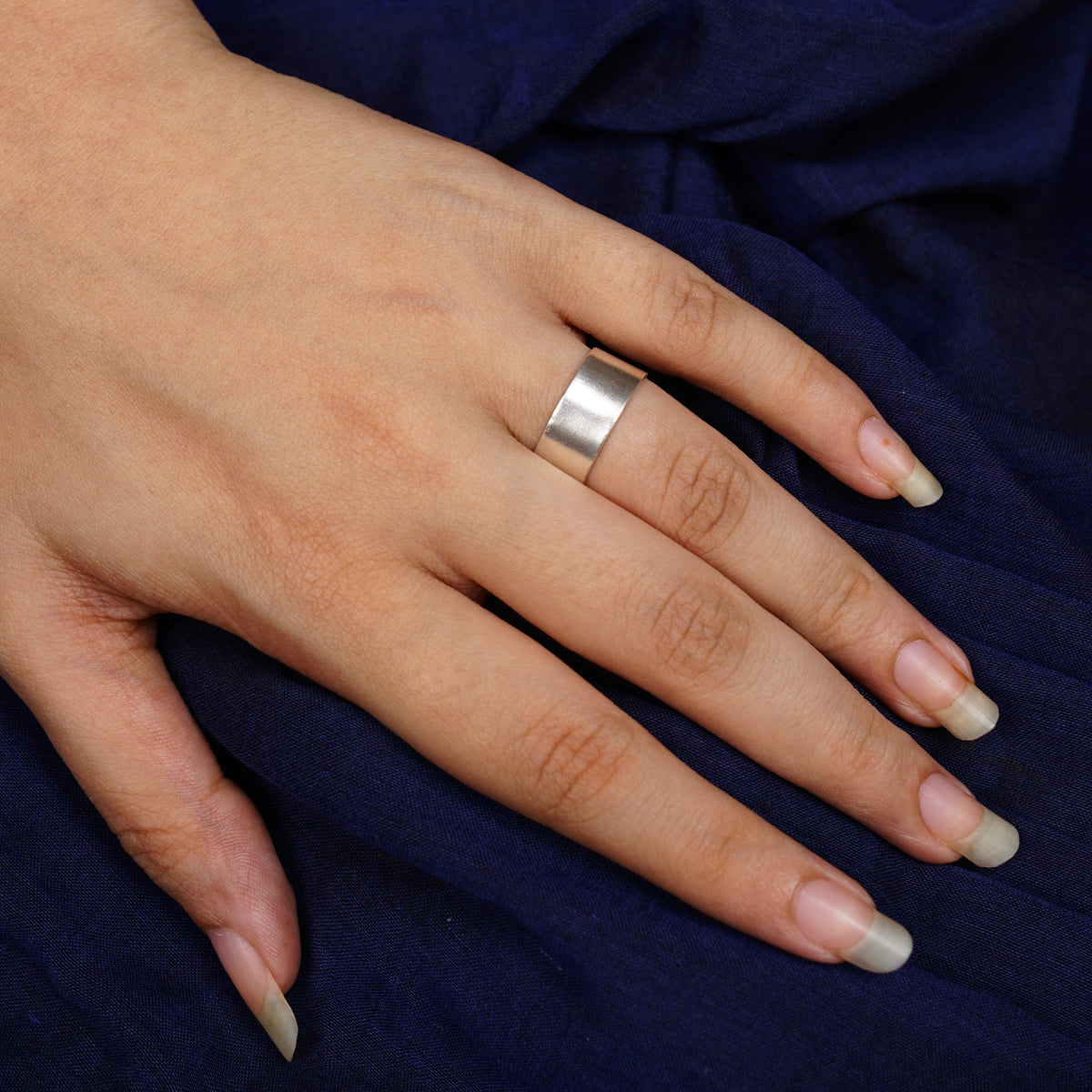 a woman's hand with a ring on it