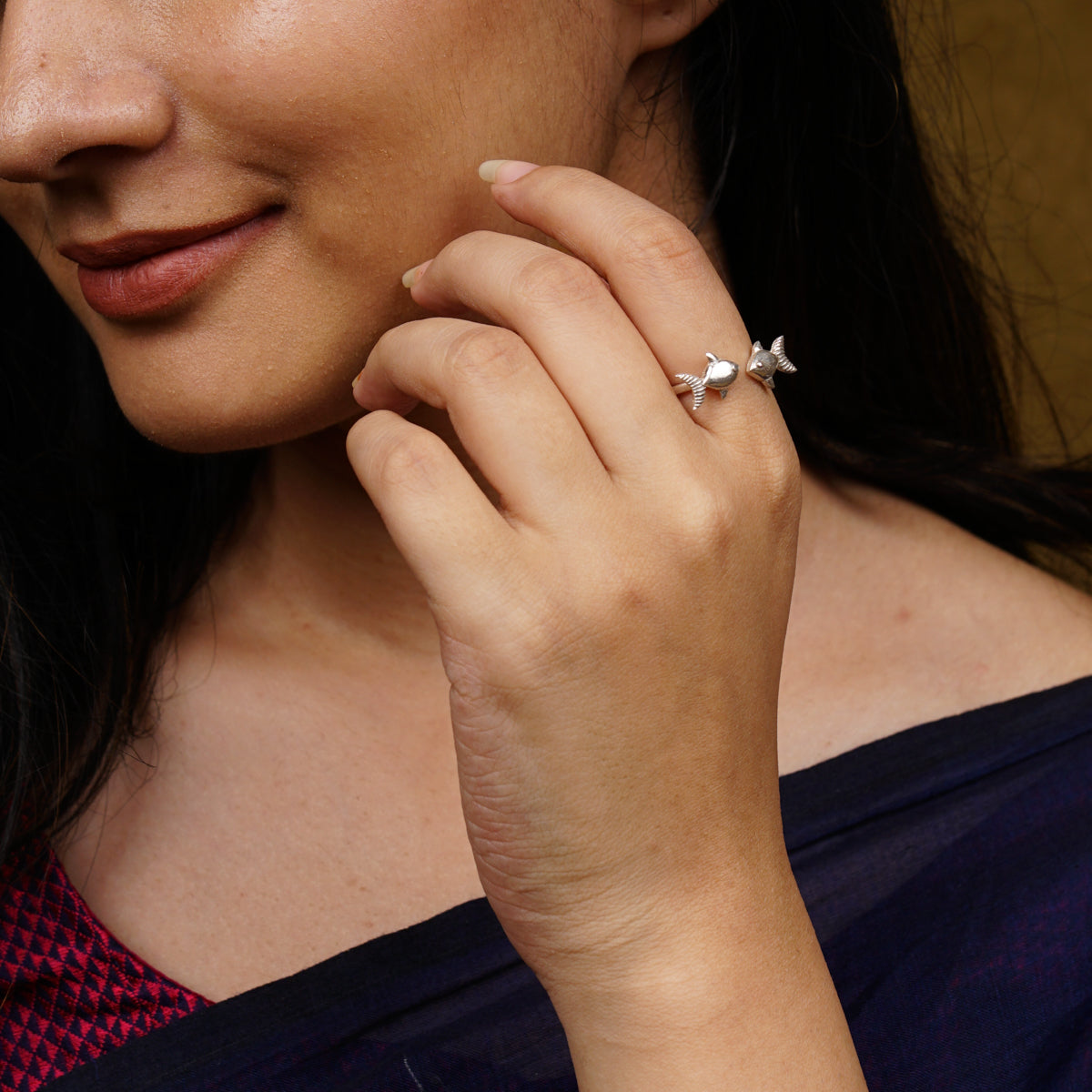 a close up of a person wearing a ring