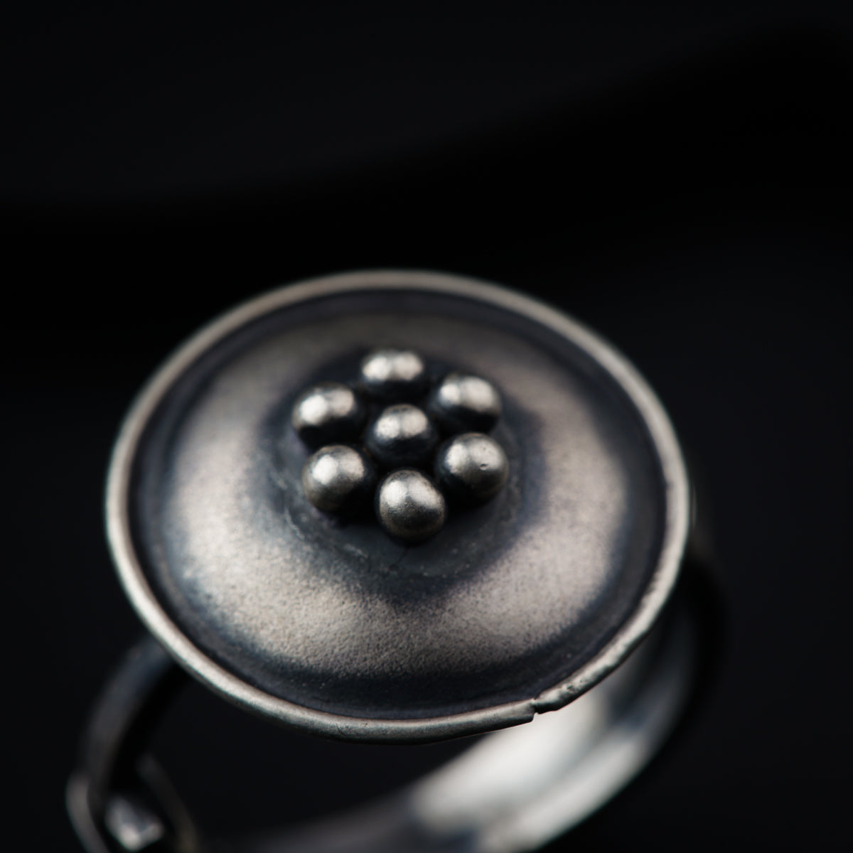 a close up of a button on a ring