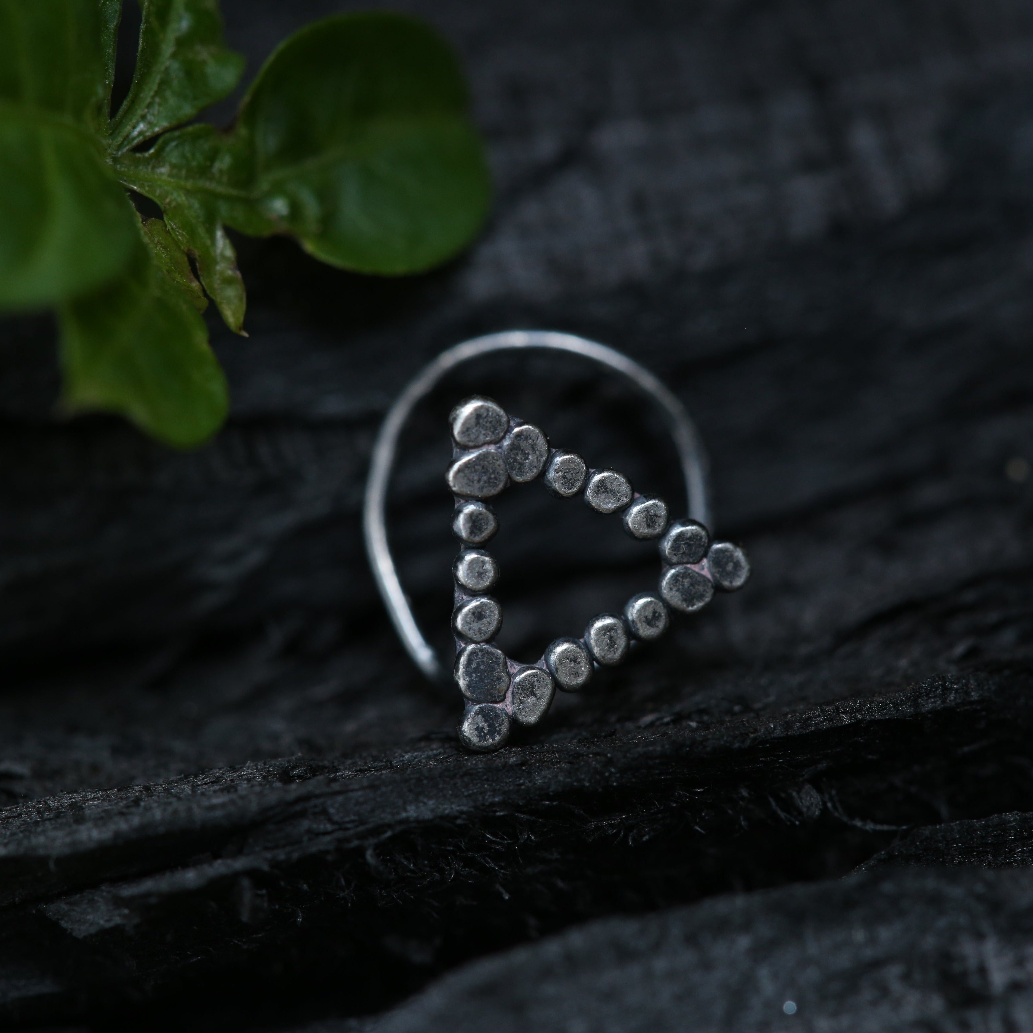 a close up of a ring on a rock