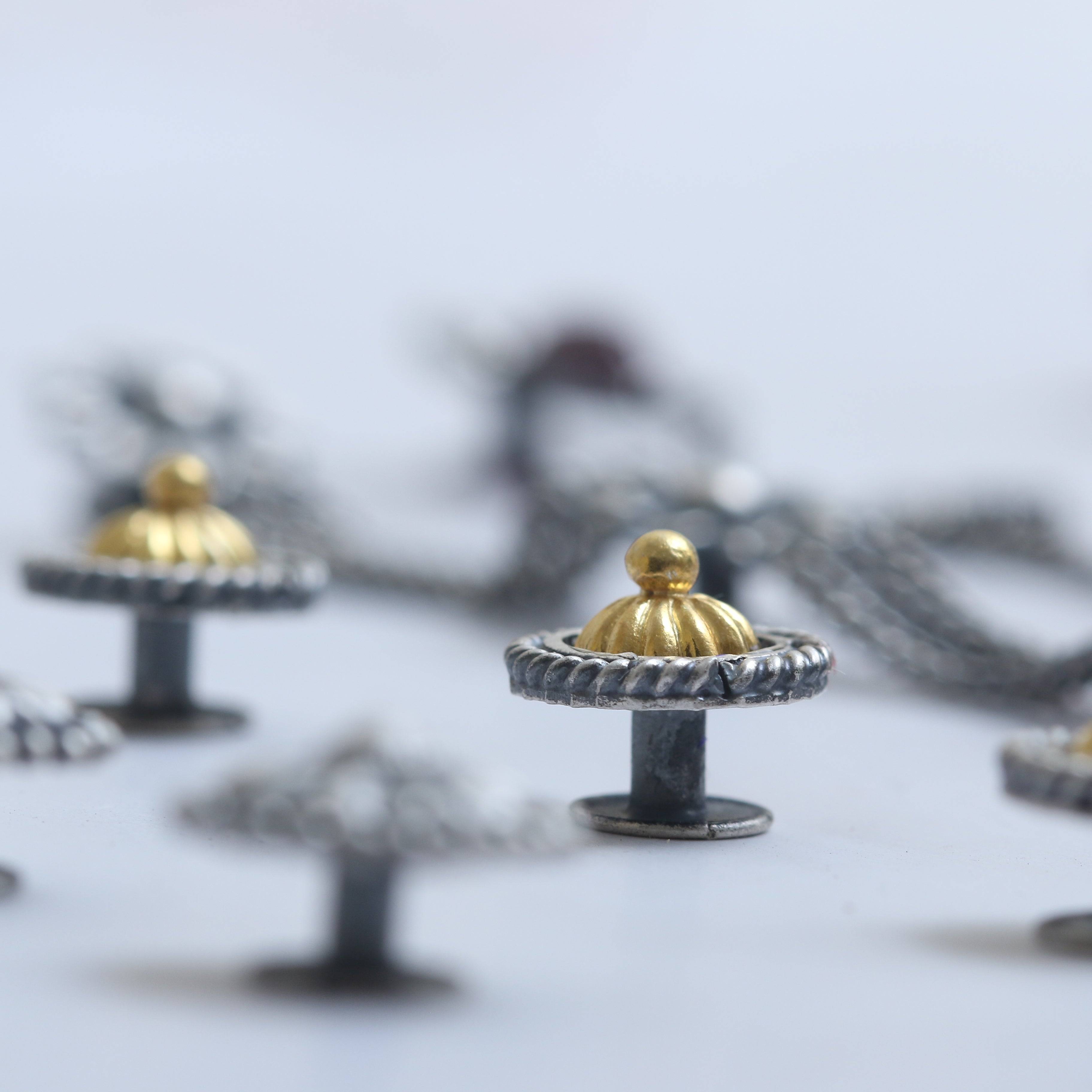 a close up of a bunch of rings on a table