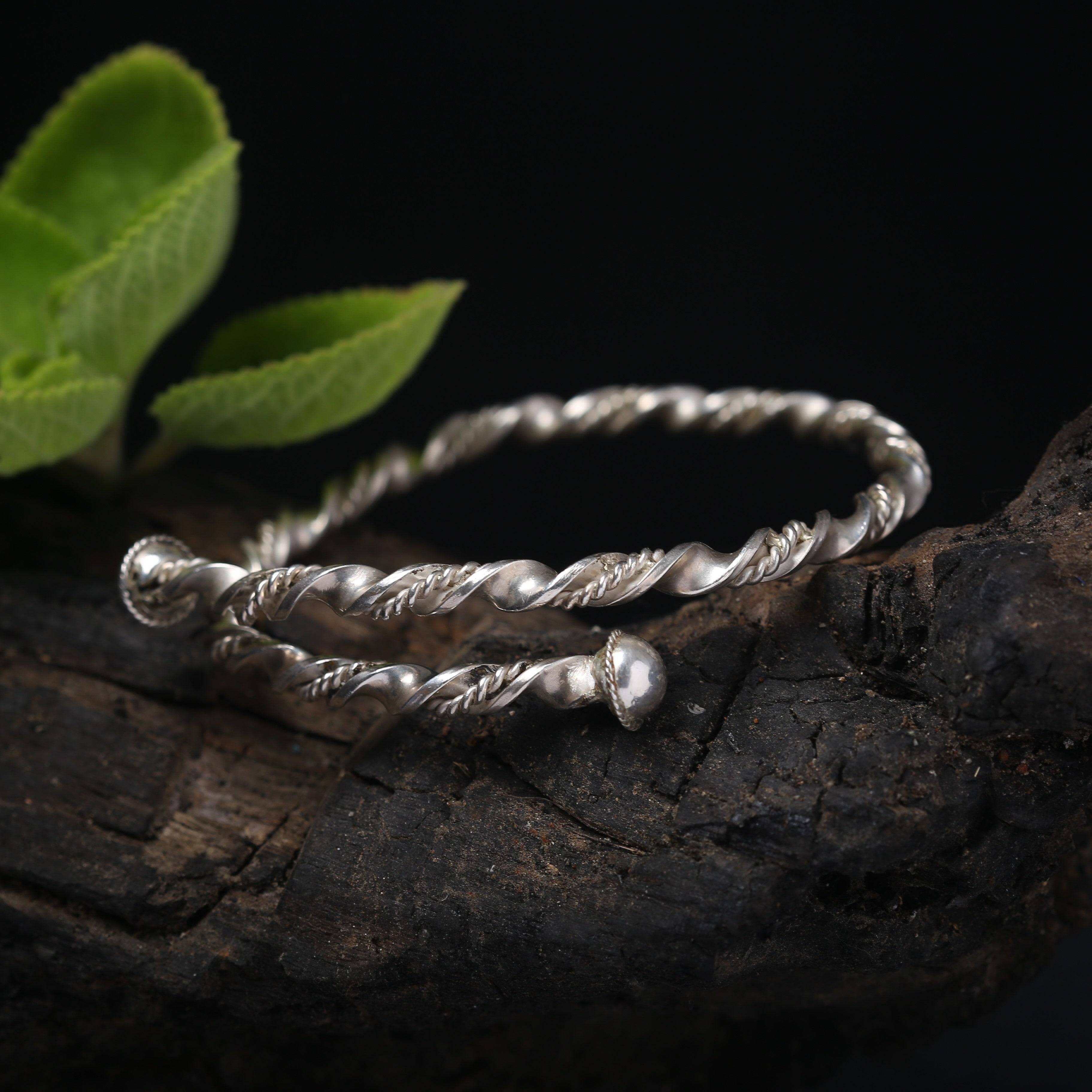 a close up of a pair of silver rings