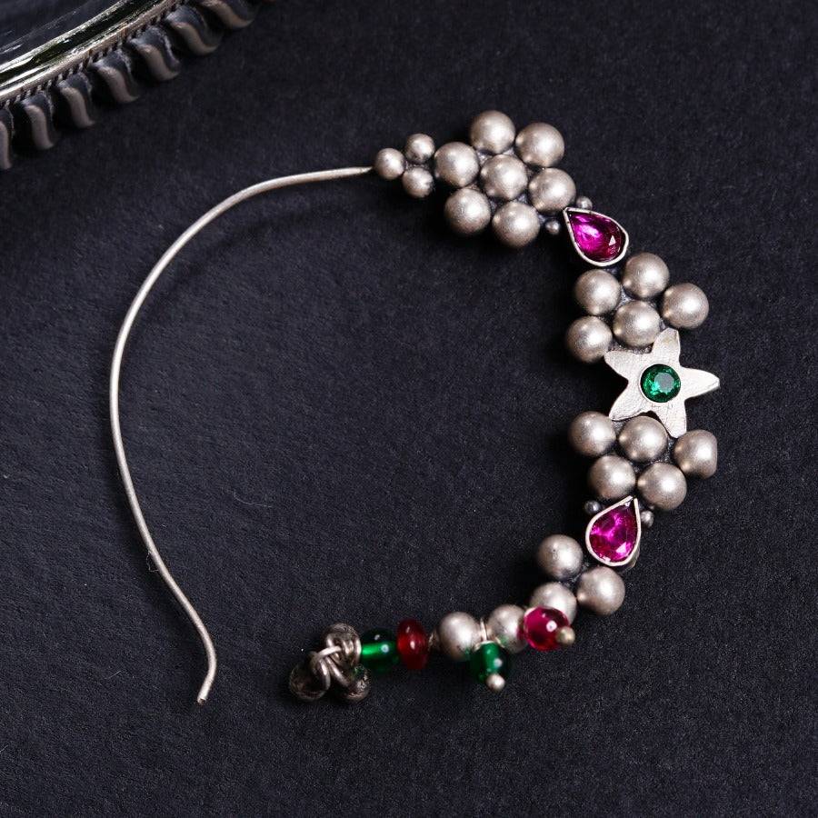 a close up of a bracelet on a table