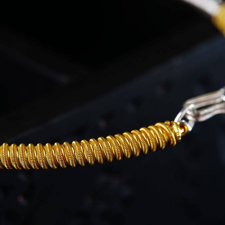 a close up of a gold colored metal object