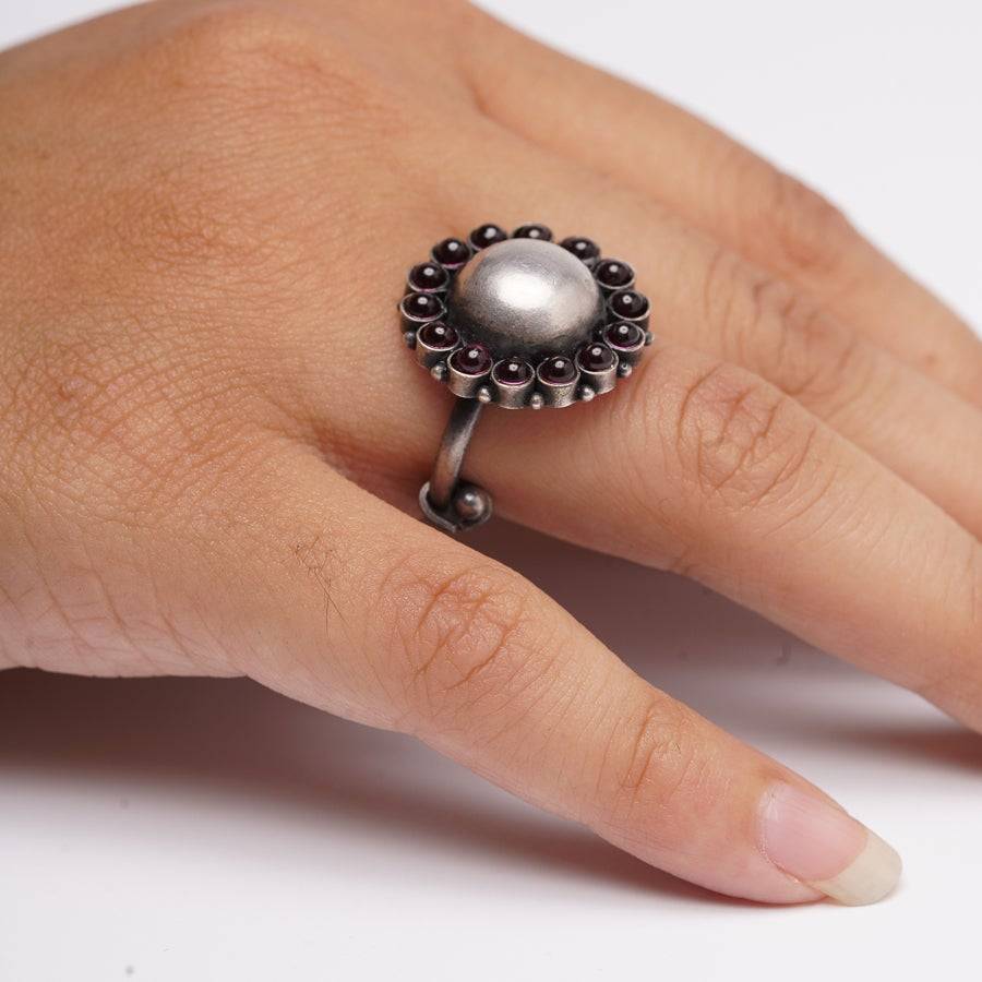 a woman's hand with a ring on it