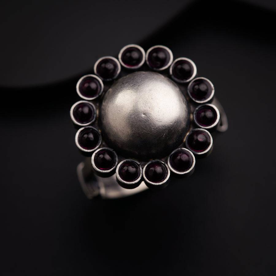 a close up of a ring on a black surface