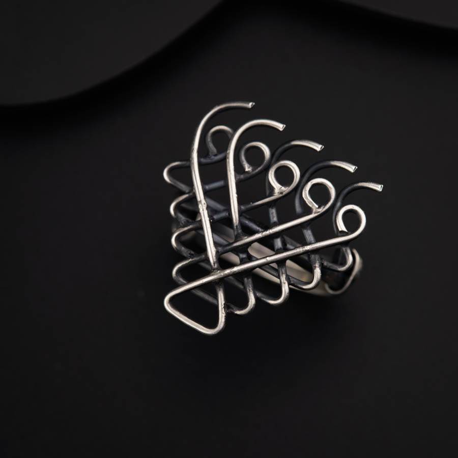 a close up of a metal object on a black surface